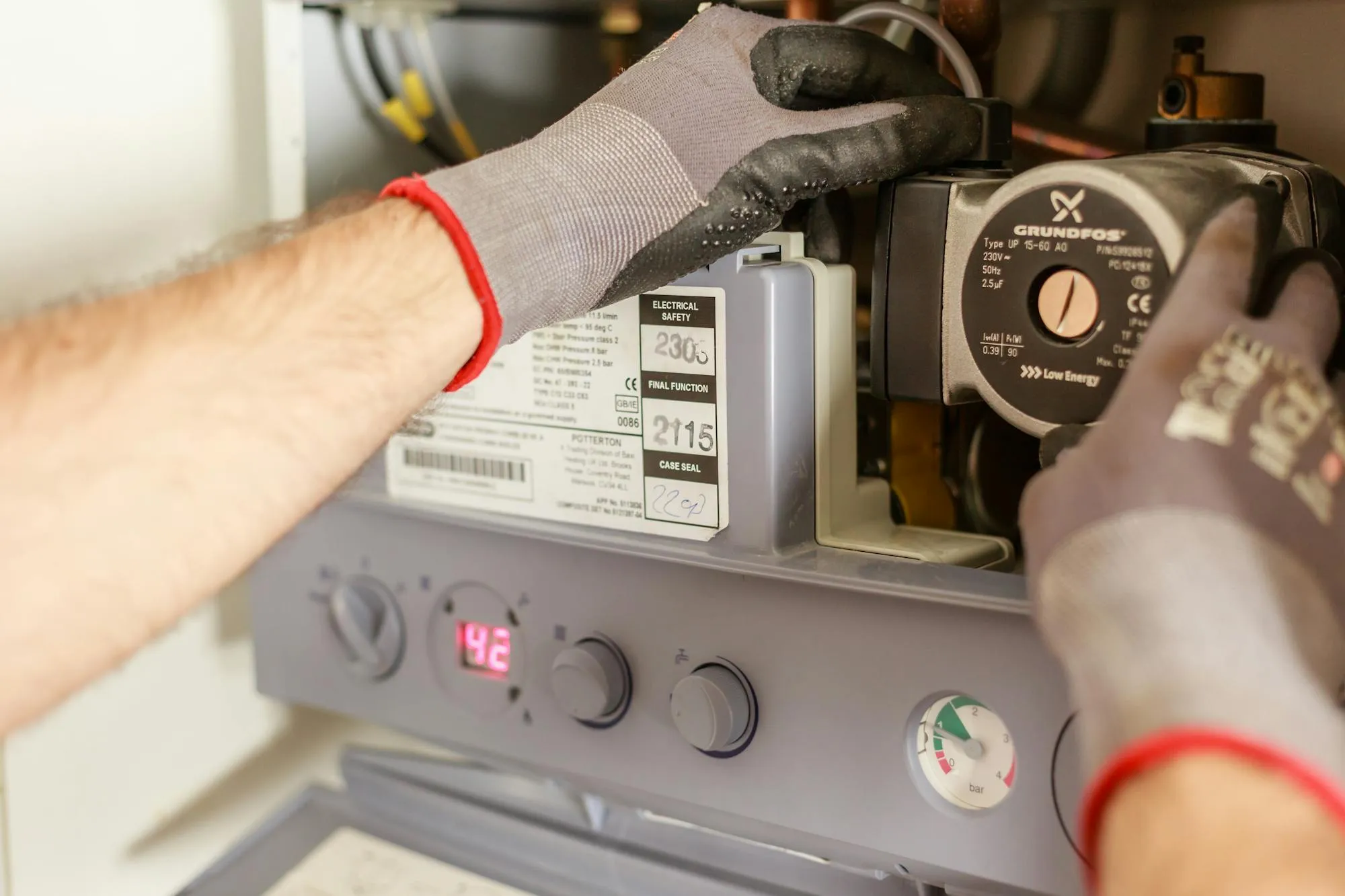 Engineer servicing a Potterton combi boiler in a Wolverhampton home